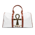 Pharaohs Pride USA Egyptian Heritage travel bag with all-over print, brown leather handles, and gold zipper