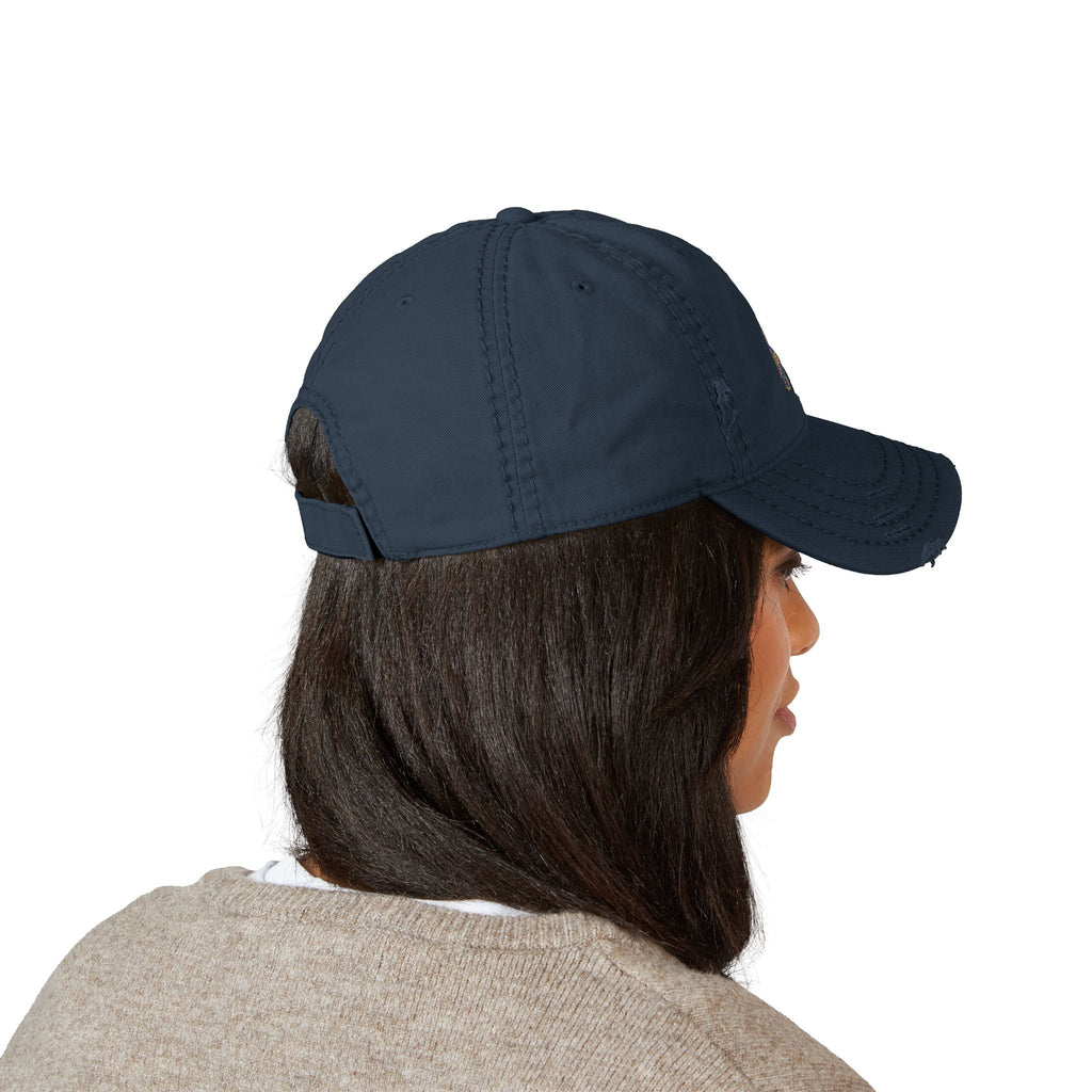 Distressed dad hat with Egyptian falcon and sun disk embroidery